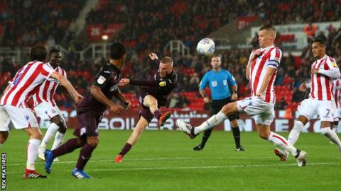 Substitute Oli McBurnie almost snatched an equaliser for Swansea at Stoke