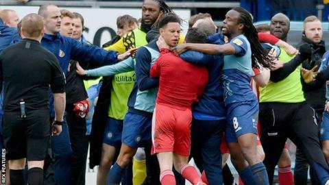 Sunderland captain George Honeyman and Wycombe forward Nathan Tyson (centre) were both sent off in the 95th minute incident at Adams Park