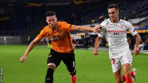 Matt Doherty playing for Wolves against Sevilla's Sergio Reguilon