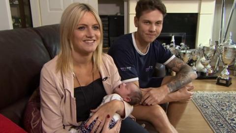 Luke Mossey with his girlfriend and daughter