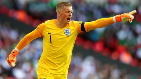 Jordan Pickford gestures to his teammates