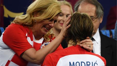 Croatia president Kolinda Grabar-Kitarovic embraces Luka Modric after the World Cup final