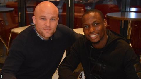 Mainz sporting director Rouven Schröder and Nigeria striker Anthony Ujah