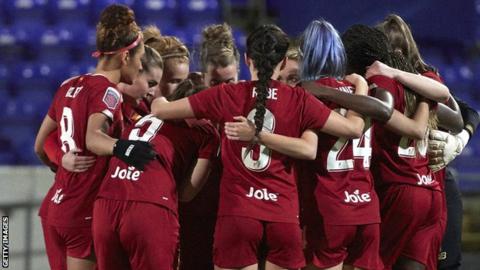 Liverpool women huddle