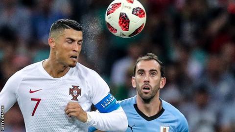 Cristiano Ronaldo wins a header against Uruguay