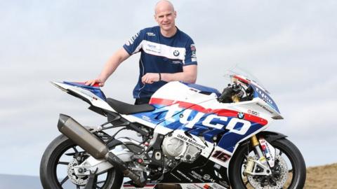 Ryan Farquhar with the Tyco BMW Superbike he will ride at the Isle of Man TT