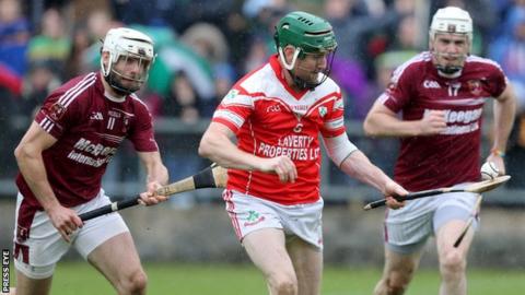 Cushendall's Neil McManus and Donal McNaughton attempt to keep pace with Loughgiel's Martin Scullion in last year's Antrim Hurling semi-final