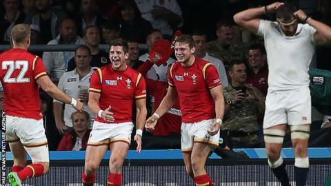 Rhys Priestland (left), Lloyd Williams and Dan Biggar celebrate Wales' win against England