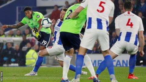 Nathaniel Mendez-Laing curls his shot around the Brighton defence for his goal in the first half