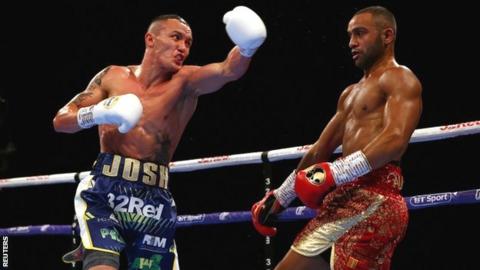 Josh Warrington throws a punch during his fight with Kid Galahad