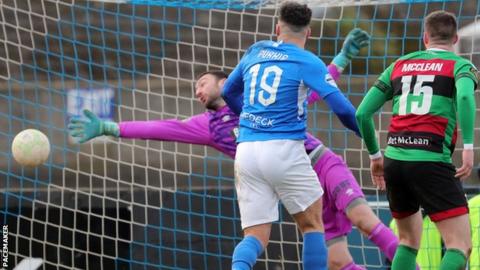 Glens keeper Marijan Antolovic can't keep out Daniel Purkis' header to bring Glenavon level
