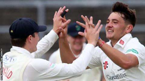 Lukas Carey (right) celebrates the key wicket of Northamptonshire's Ben Duckett with Aneurin Donald