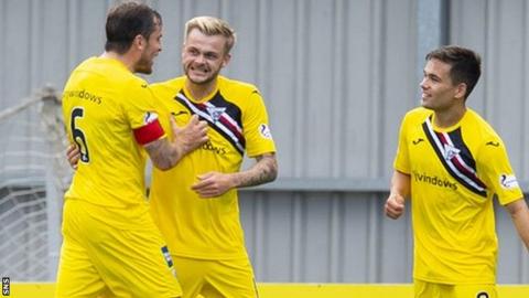 Andy Ryan (centre) celebrates doubling Dunfermline's lead