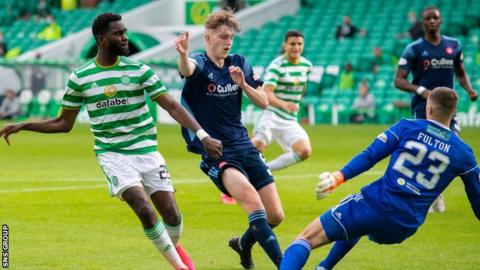 Edouard finishes the second of his three goals at Celtic Park