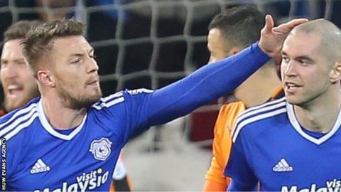 Matthew Connolly of Cardiff City is congratulated by Anthony Pilkington