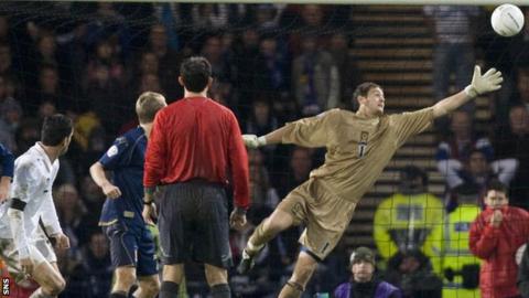 Christian Panucci (left) watches as his header beats Craig Gordon in Italy's win over Scotland in 2007