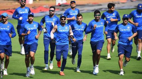 Kohli (centre) leads his team in training before a T20 match against Australia on Sunday