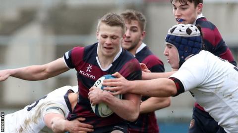 MCB pair Jonah Bingham and Ben Crangle attempt to halt the run of BRA captain Conor McAuley