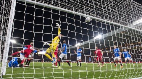 Lewis Ferguson scores for Aberdeen in the League Cup semi-final against Rangers