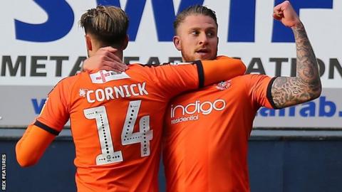 George Moncur celebrates with Harry Cornick
