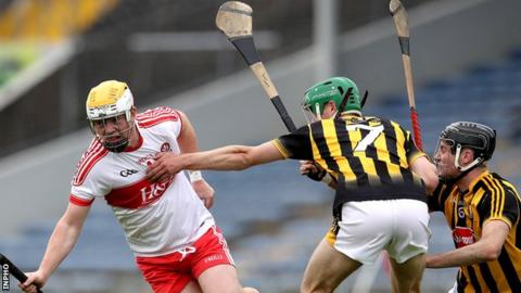 Derry's Ruairi McCartney attempts to evade Kilkenny pair Jason Cleere and Tommy Walsh in the semi-final