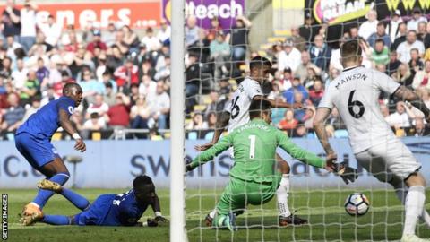 Kyle Naughton scores an own goal just before half-time