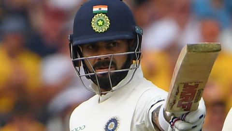 Virat Kohli celebrates his half-century