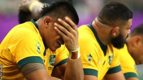 Australia players dejected after defeat by England