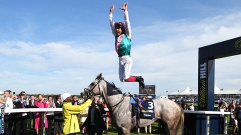 Frankie Dettori leaps off Logician