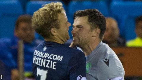 Rory McKenzie of Kilmarnock and Hibernian's Lewis Stevenson square up