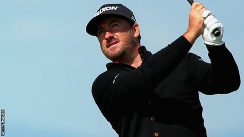Graeme McDowell plays an approach shot at the 13th at Gullane on Thursday