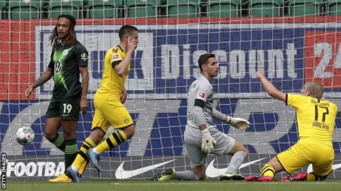 Raphael Guerreiro celebrates scoring for Dortmund