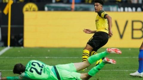 Jadon Sancho scores for Borussia Dortmund against Hertha Berlin