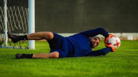 Libyan goalkeeper Mohamed Al-Forgany