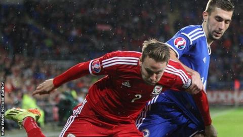Wales' Chris Gunter and Bosnia and Herzegovina's Tino-Sven Susic tussle