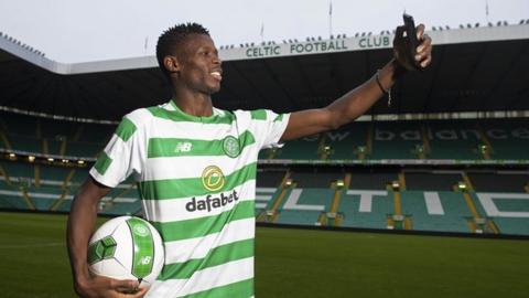 Vakoun Issouf Bayo takes a selfie of himself in his Celtic shirt