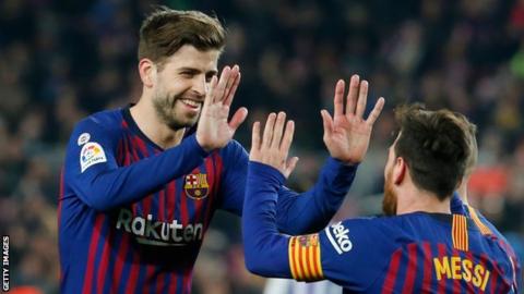 Gerard Pique and Lionel Messi