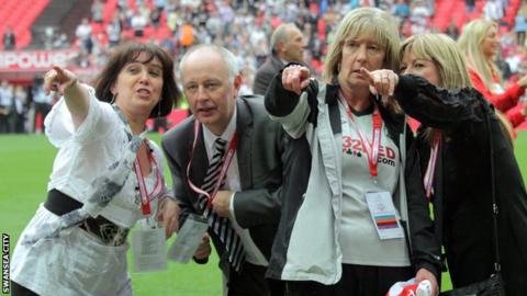 Jackie Rockey celebrates at Wembley with other Swansea City staff