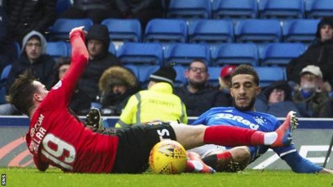 Kilmarnock's Liam Millar is pulled down by Rangers' Connor Goldson