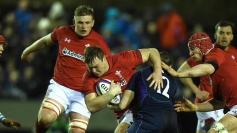 Dewi Lake is tackled by Robbie McCallum