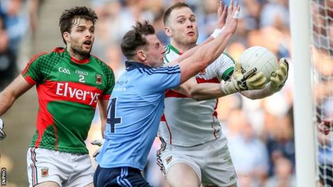 Philly McMahon beats Mayo goalkeeper Rob Hennelly to score Dublin's second goal in Croke Park