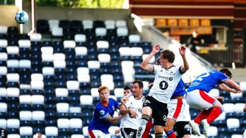 Anders Konradsen heads in the opener for Rosenborg against Linfield