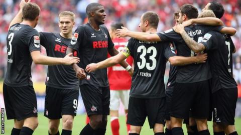 FC Koln players celebrate after the draw