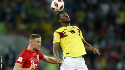 Jefferson Lerma wins a header during Colombia's defeat by England at the World Cup