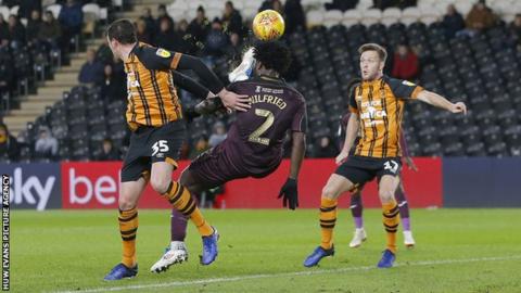 Swansea striker Wilfried Bony tries an overhead shot on goal against Hull