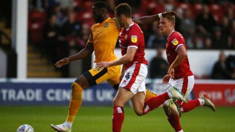 Jamille Matt of Newport County takes a shot at goal against Walsall