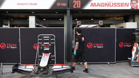 A man walking into the Haas team garage at Albert Park in Melbourne