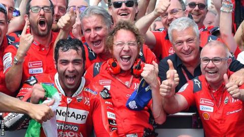 Danilo Petrucci celebrates winning the Italian GP with his Ducati team