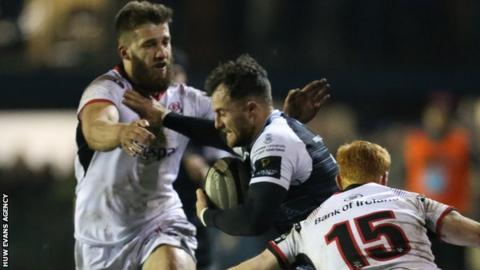 Luke Morgan of Ospreys takes on Ulster's Stuart McCloskey and Peter Nelson