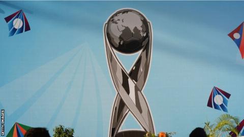 A mural of the Under-17 World Cup trophy
